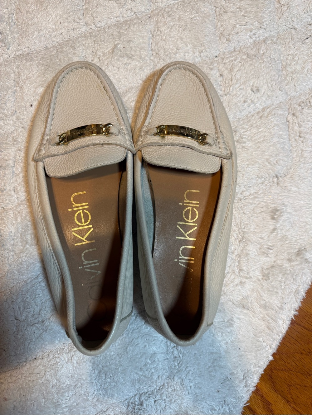 Calvin Klein women’s Cream Leather Slip-On Loafers with Gold Hardware